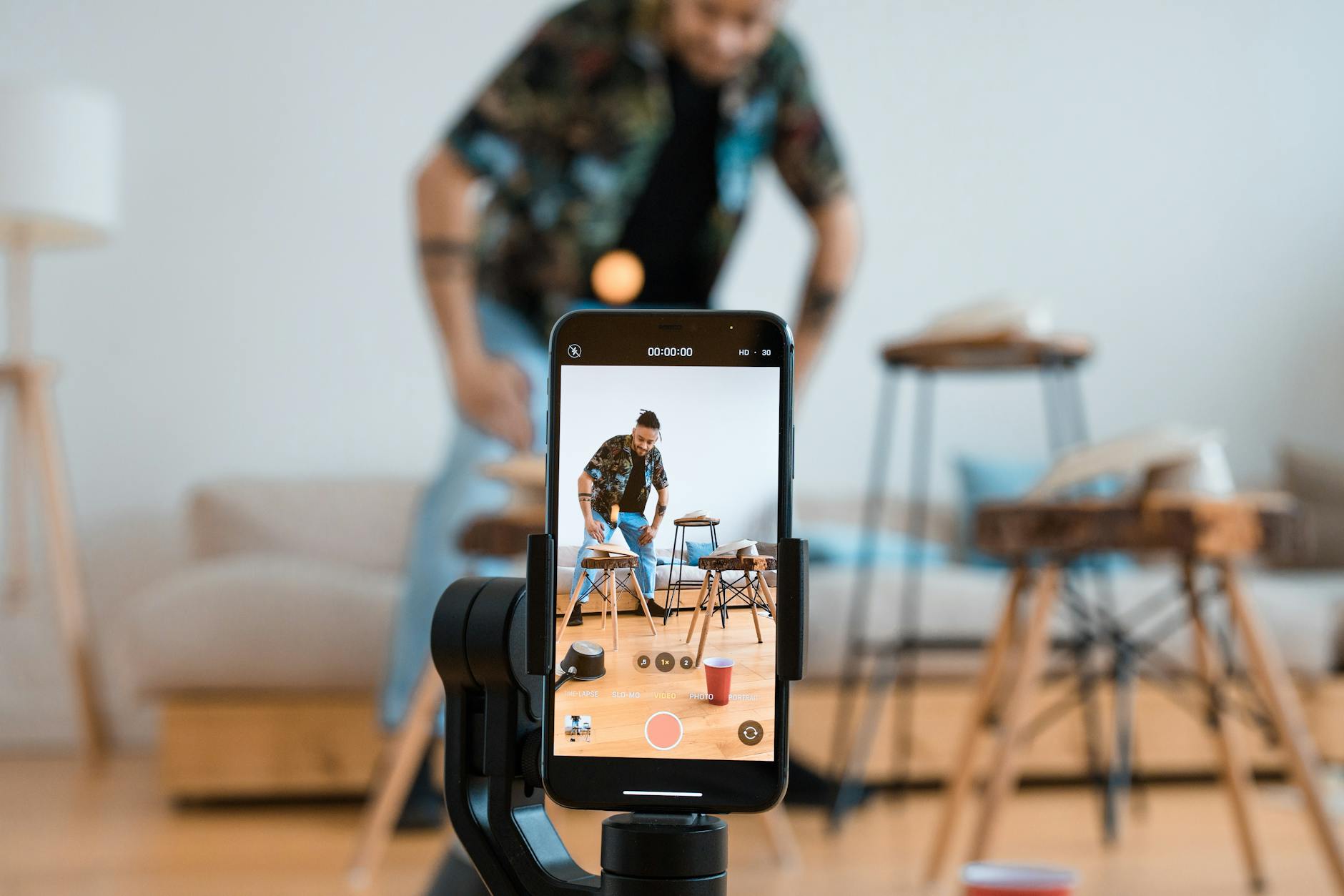 Person creating a promo video online using an AI video editor on a laptop
